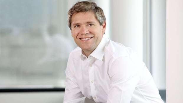 Keywords Studios' CEO Bertrand Bodson sitting in a white room and smiling at the camera